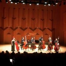 Mikyung Sung taking bows with 6Bass after recital