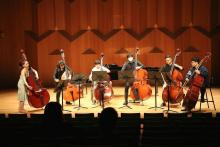 Mikyung Sung warming up with double bass sextet before recital